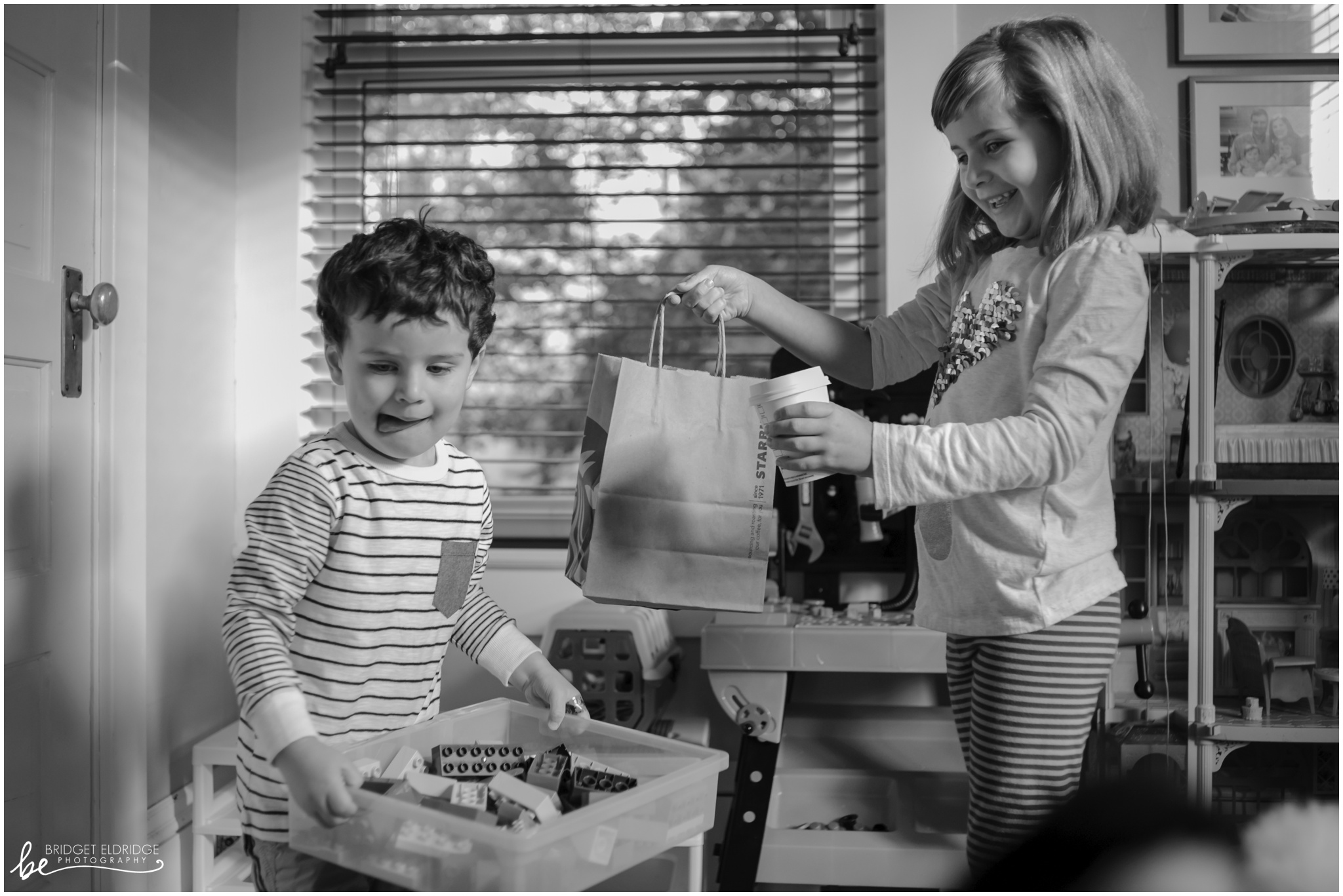 dc-day-the-life-family-photography-rowands-010002.jpg sister shows brother breakfast from Starbucks