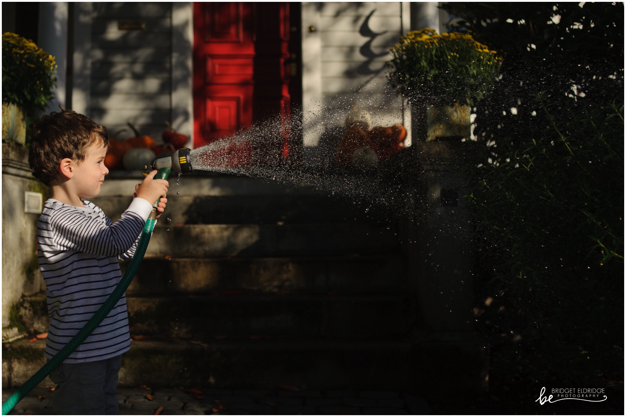 dc-day-the-life-family-photography-rowands-010022.jpg boy waters his plants