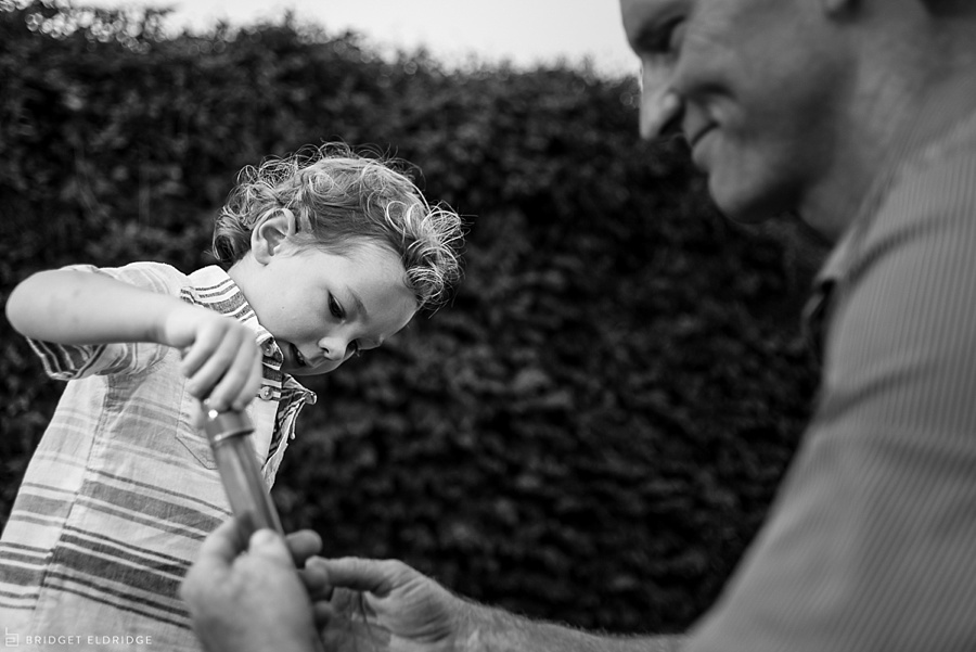 boy plays with bubbles in old town alexandria